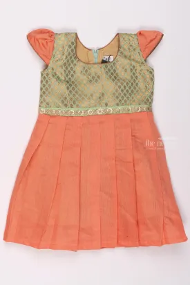 Elegant Salmon and Gold Traditional Pattu Silk Frock for Girls with Delicate Golden Patterns