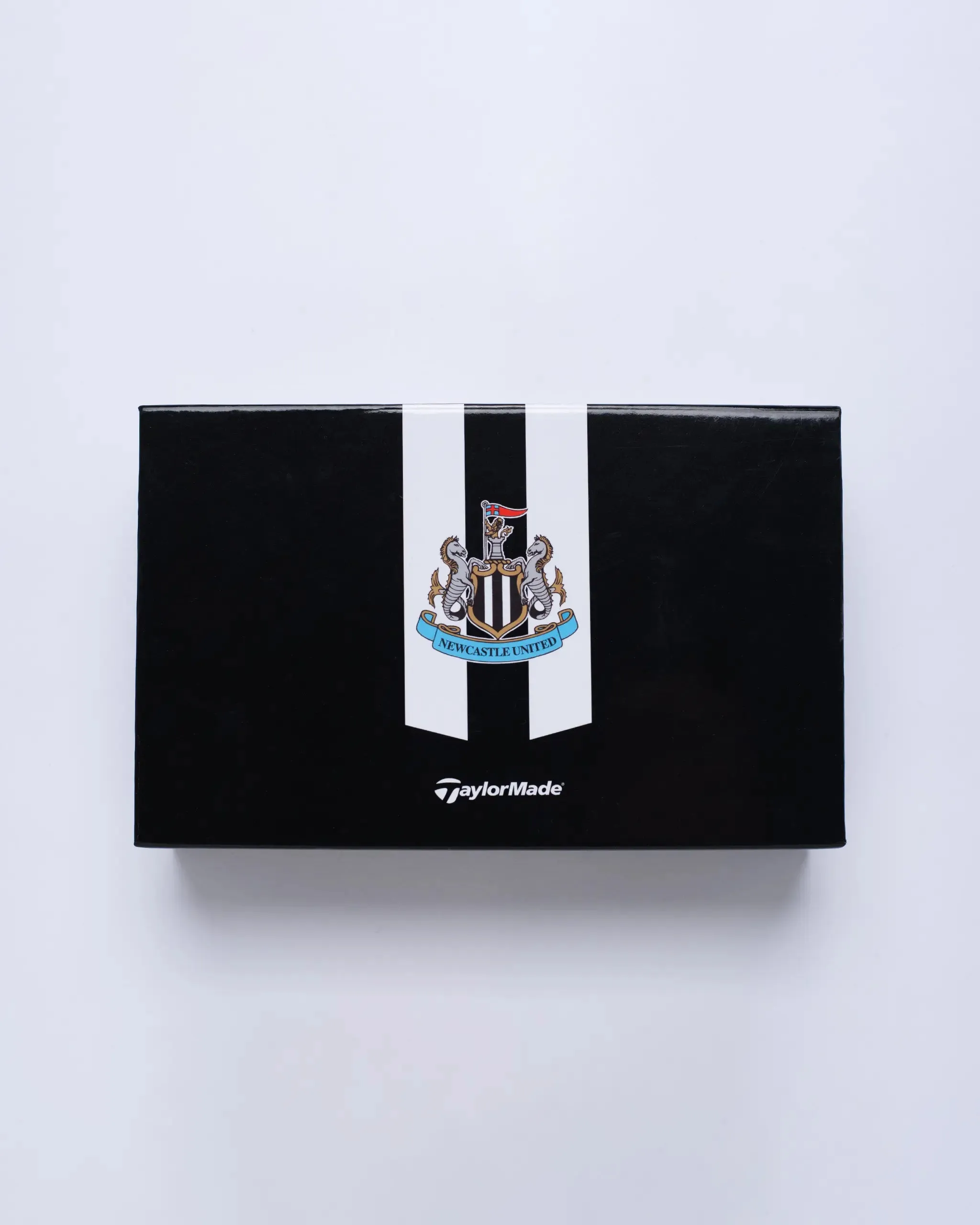 Certainly! Heres an optimized version of the product title with modifiers: 

Official Newcastle United TaylorMade Ibox Plus Golf Accessory - Premium Quality